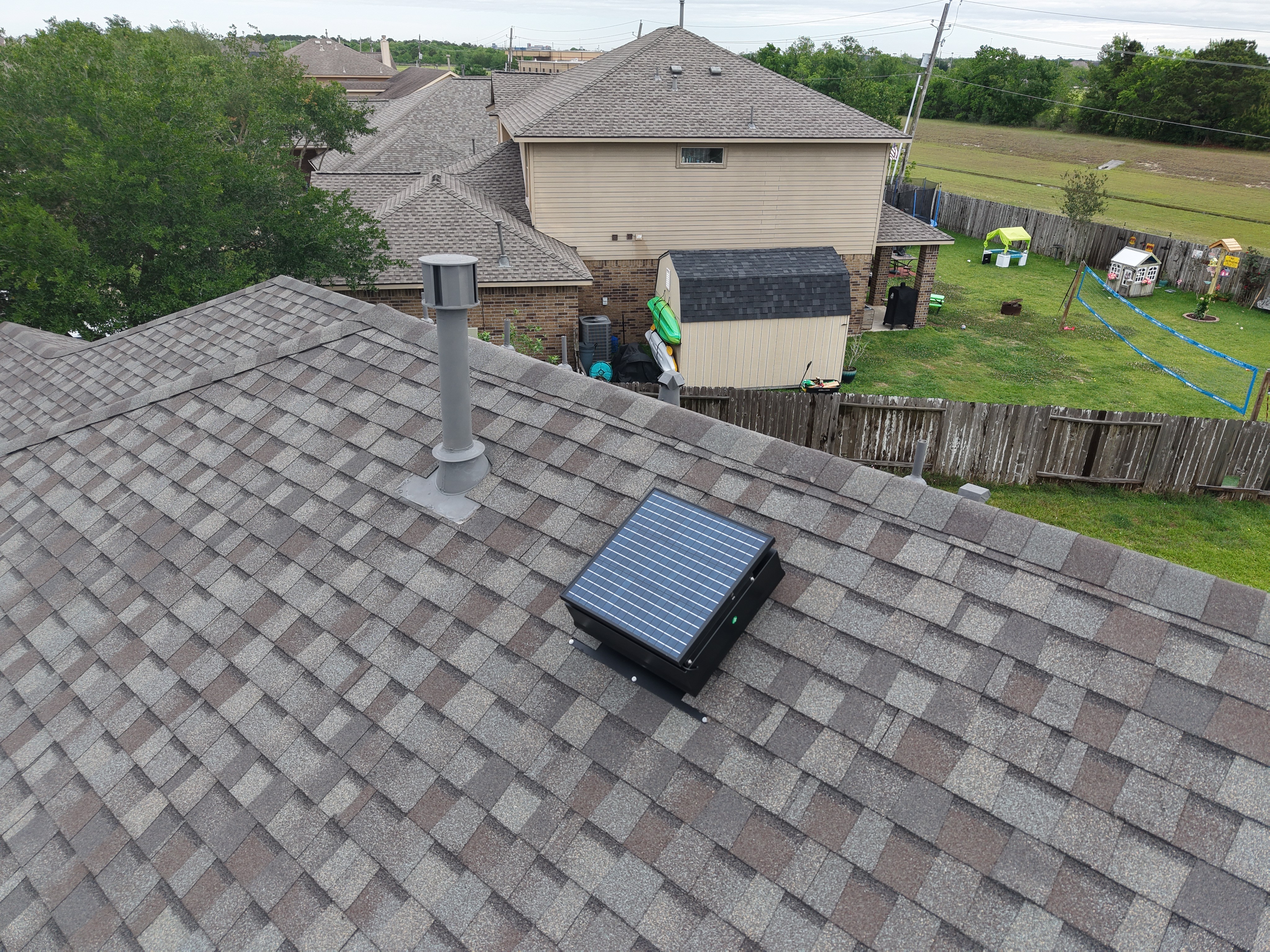Solar attic fan installed on a residential roof for contractor sizing reference